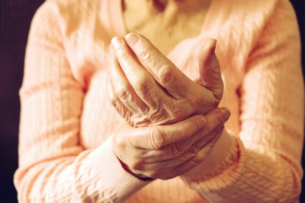 Close up of mature womans hands. Health care giving, nursing home. Parental love of grandmother